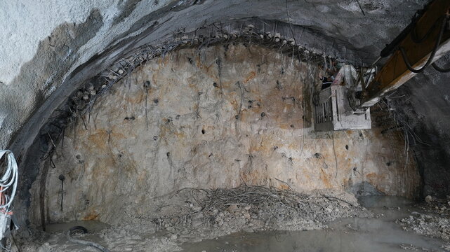 Industrial Excavator Working at Underground Tunnel Construction Site