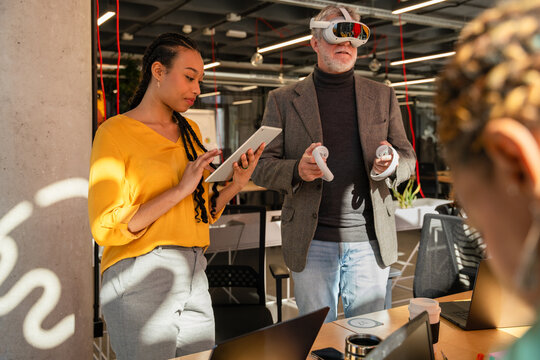 Collaboration in modern office with VR and digital tools