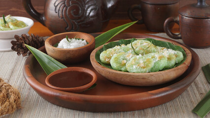 Kue Lupis, legend of traditional Indonesia rice cake snack with grated coconut and palm sugar...
