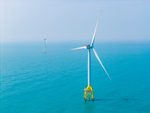Offshore Wind Turbines in Blue Sea for Clean Energy.