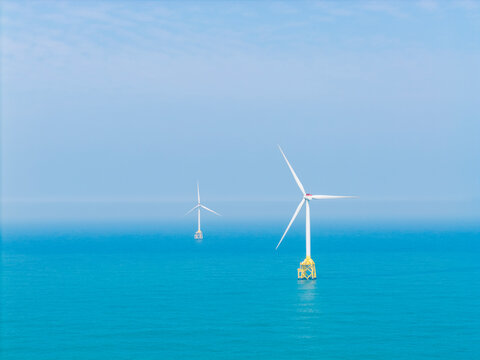 Offshore Wind Turbines in Blue Sea for Clean Energy.