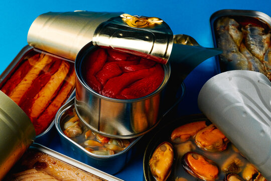 open cans with different tinned food