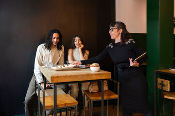 Couple doing menu testing with wedding planner 