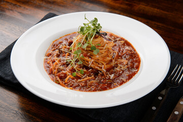 Spaghetti bolognese on a white plate
