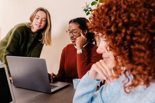 Team enjoying themselves and reviewing files in a conference room
