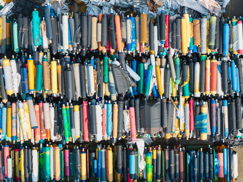 Vibrant Plastic Rolls Organized in Factory Storage Area