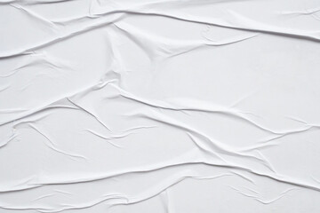 white crumpled and creased glued wrinkled paper poster texture background