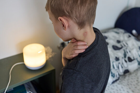 Little boy uses humidifier in his room to ease eczema
