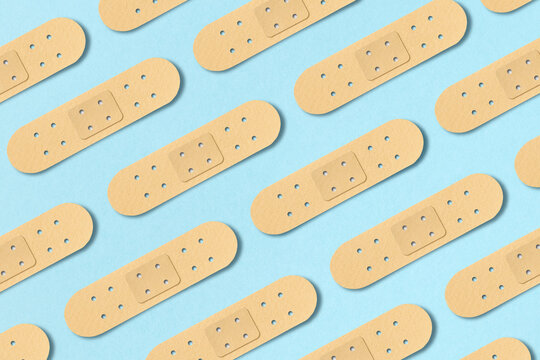 Pattern from adhesive plasters on blue
