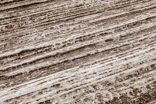 Striking abstract lines in stone and sandy landscape.