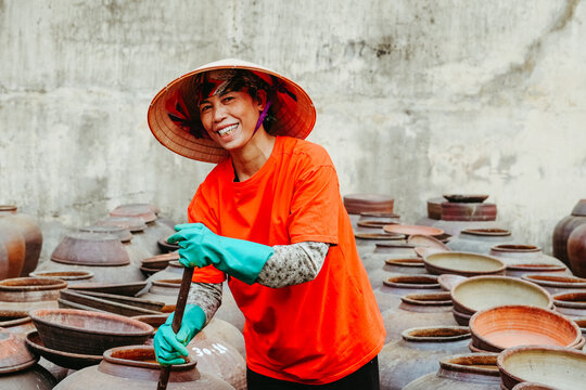 Smiling Artisan at a Vietnamese Fermentation Site