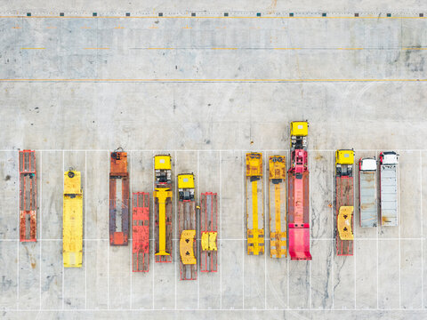 Aerial View of Parked Heavy Machinery and Trailers