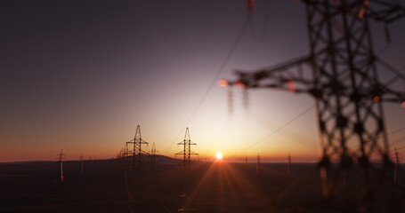 Huge power lines close up with a sunset landscape