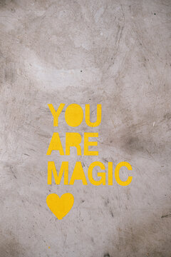 Message on concrete wall: You are magic