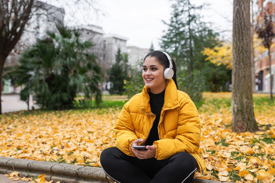 Teenage girl with headphones in the city