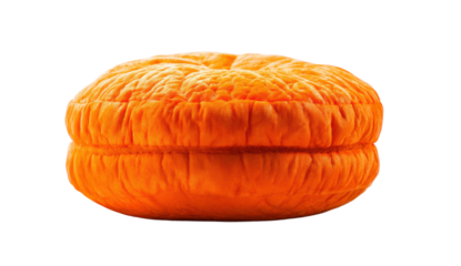 Bright orange velvet pumpkin pillow with textured design against black background, cut out