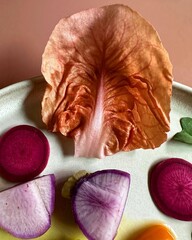 A delicious dish is perfectly styled on a soft pink background, creating a visually appealing image that blends food artistry with pastel aesthetic charm.

