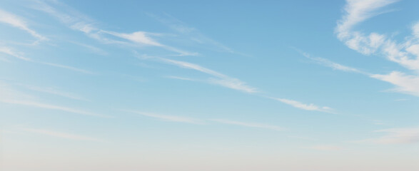 A bright blue sky with thin white clouds on a sunny day. luxury sky photos for landscape backgrounds and wallpapers.