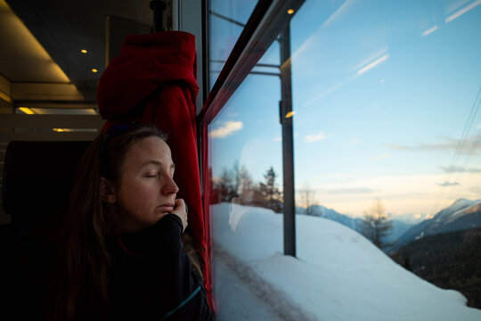 Woman sleeps during train journey