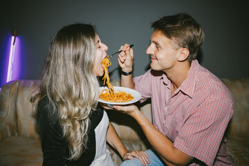 Playful Pasta Moment Between Couple