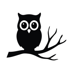 Silhouette of an owl perched on a tree branch