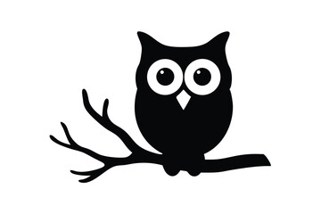 Obraz premium Silhouette of an owl perched on a tree branch