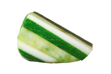 Close-up image of green and white striped soap bar on black background, cut out