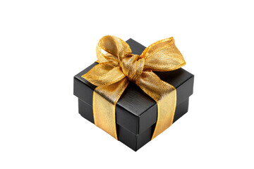 Elegant black gift box with gold ribbon on black background, cut out