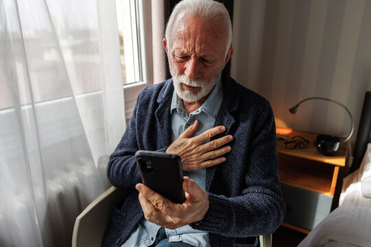 Sad senior talking on video call