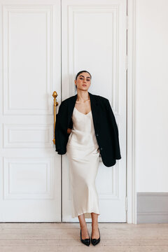 Stylish woman in elegant dress and oversized blazer