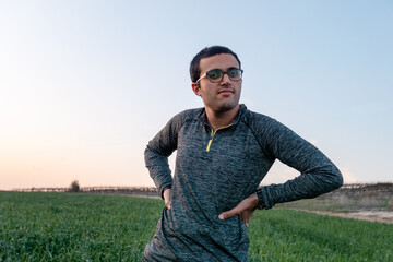  Confident Teen  Standing in Open Field at Sunset