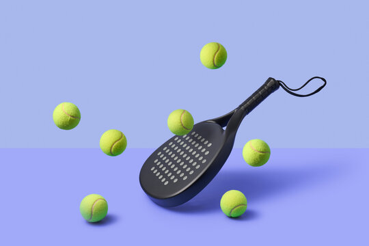 Paddle racket with moving yellow balls in violet studio background