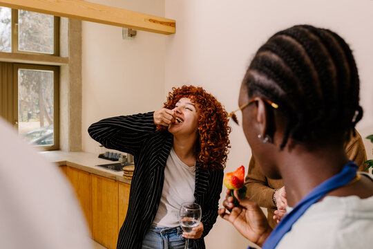 Office worker enjoying snacks during a social gathering