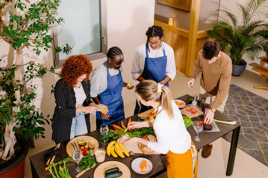 A group of people taking a shared cooking class