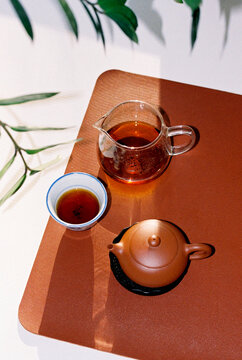 Still life with traditional Chinese pu erh tea in clay teapot.