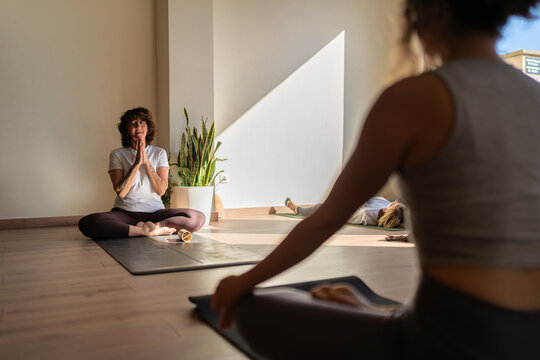 Yoga instructor guiding meditation during therapy and relaxation
