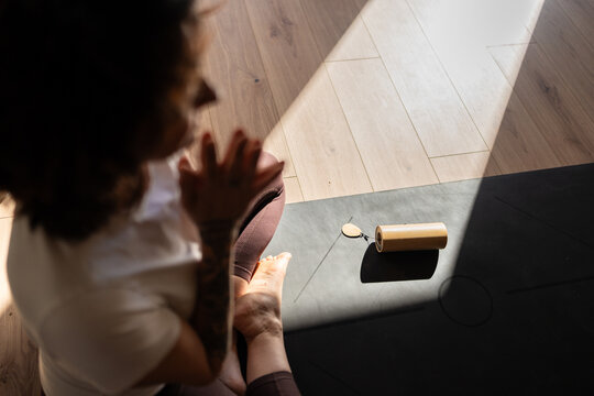 Woman practicing yoga for relaxation and therapy in a group class