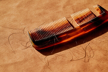 broken comb with some hair