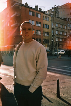 Young man poses on the street