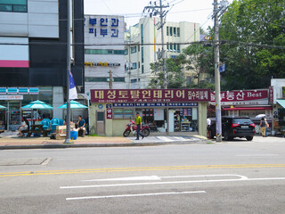 Various views of streets and buildings in a South Korean city.
