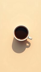  Minimalistic top view of a cup of black coffee casting a long shadow on a beige background