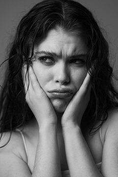 Expressive bw portrait of a model posing in studio