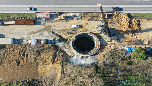 Aerial View of Construction Site with Excavation and Roadside Machiner