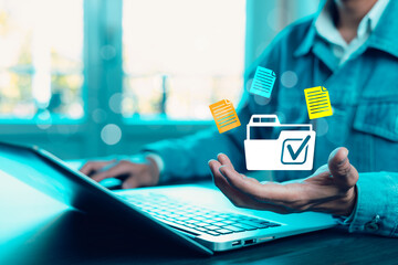 Businessman working on laptop with virtual screen. Online documentation database, IT consultant being set up Virtual Document Management System with a laptop, Software for archiving corporate files.
