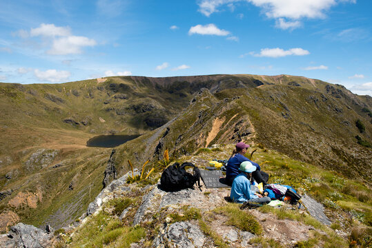 Hikers having lunch in the outdoors, New Zealand.