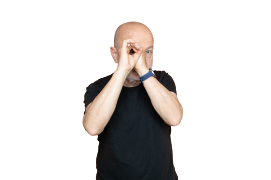 A man looking through a hand in front of his face