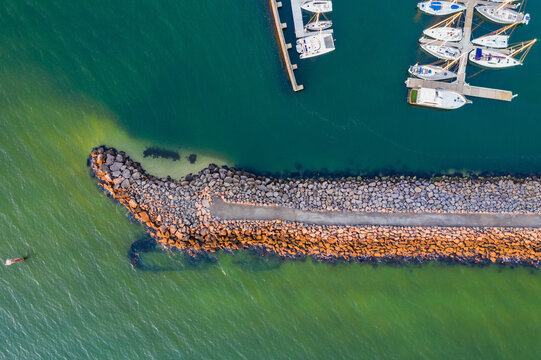 Rocky breakwater shielding baots at a marina