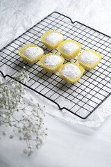Freshly baked confections cooling on a wire rack in a cozy kitchen