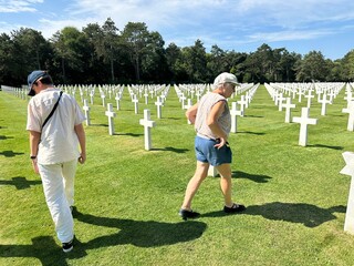 grandmother and grandson visiting American cemetery from WWII