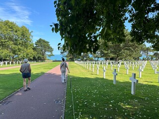 grandmother and grandson visiting American cemetery from WWII